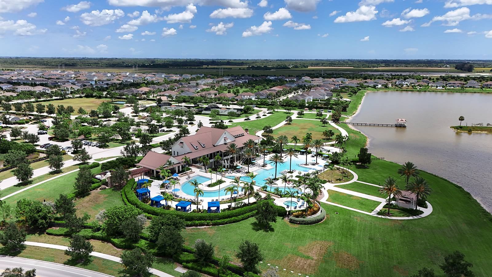 The Arden clubhouse and pool campus beside the lake