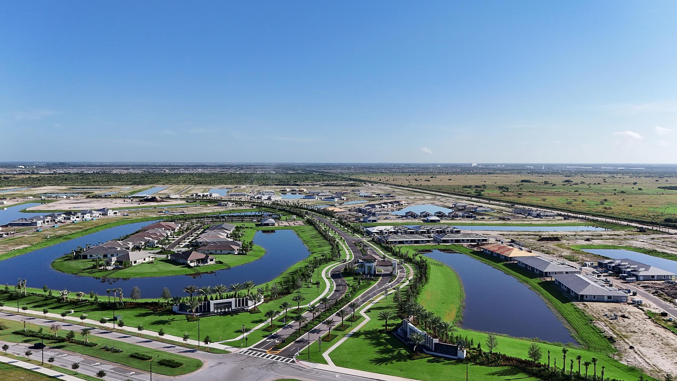 Aerial of the full Catalina Palms community with boulevard and lakes