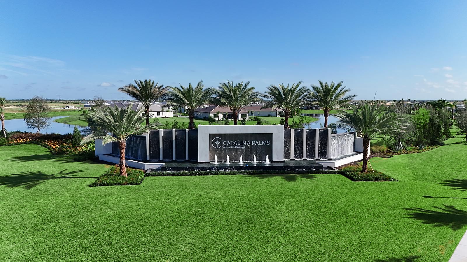 Head-on view of the finished Catalina Palms entrance with fountains running