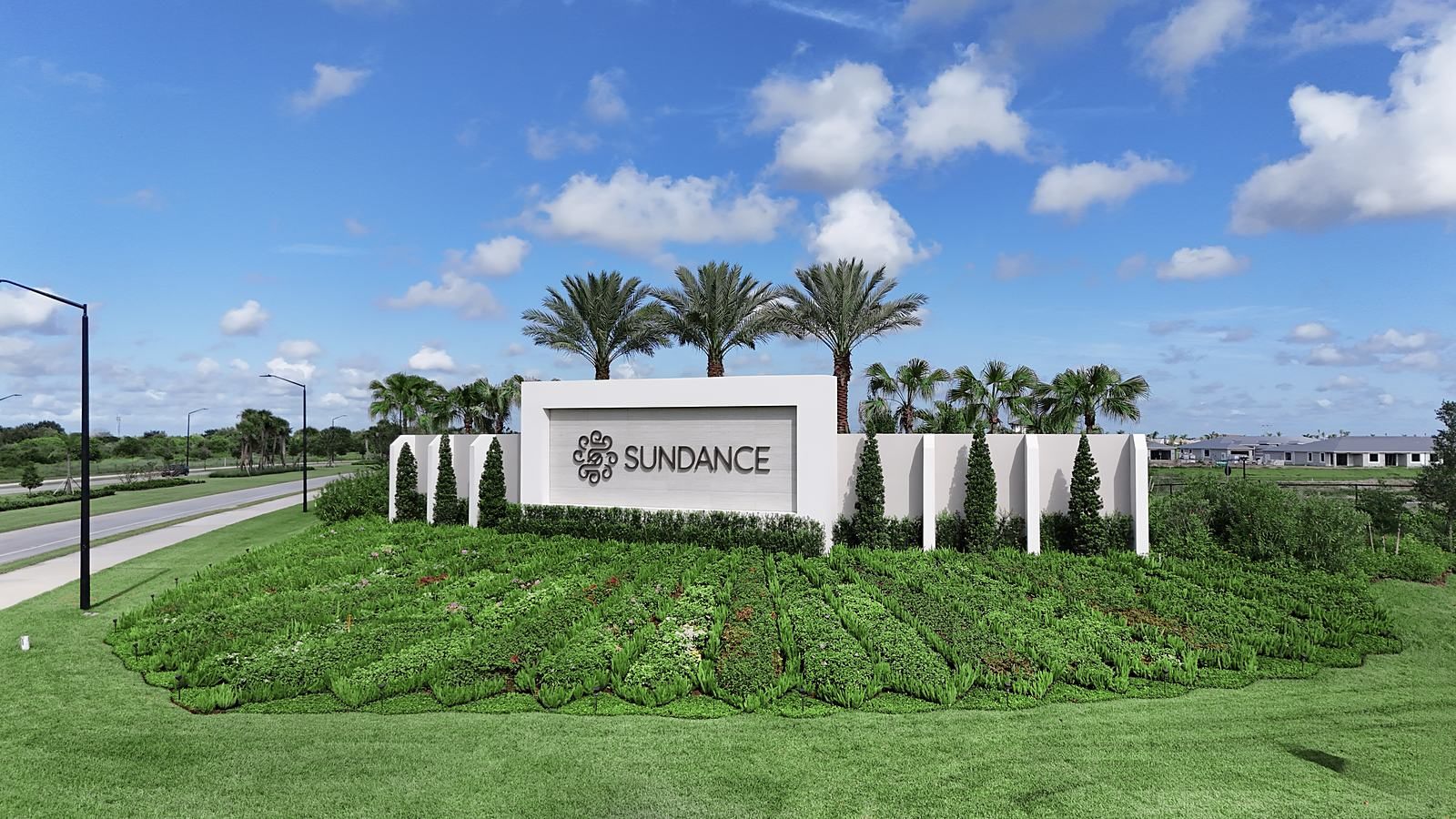 The Sundance monument wall with tiered planting beds at the community entrance